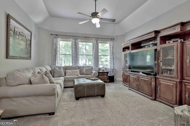 living room featuring light carpet, a ceiling fan, and lofted ceiling