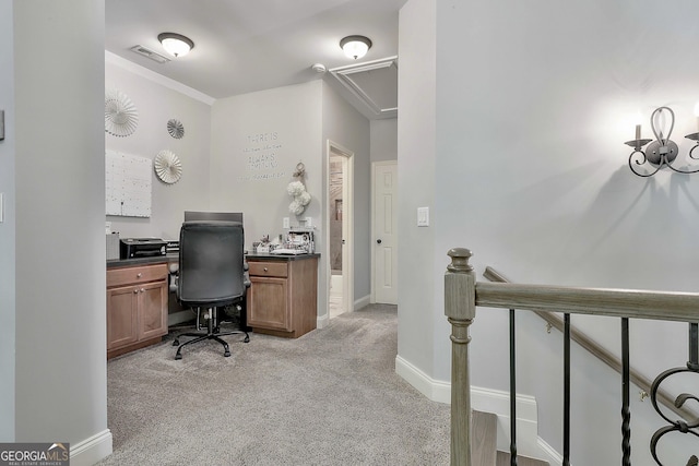 home office with visible vents, baseboards, light colored carpet, and attic access