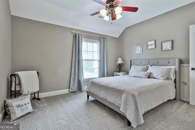bedroom with baseboards, a ceiling fan, carpet, and vaulted ceiling