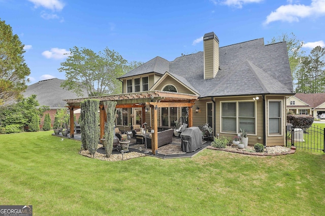 back of house featuring a patio area, fence, a yard, a pergola, and outdoor lounge area