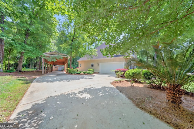 229 Old Plantation Trl NW, Milledgeville, GA 31061 - view of front of home with a carport, an attached garage, and concrete driveway