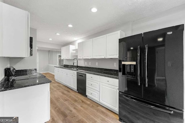 kitchen with light wood-type flooring, recessed lighting, white cabinetry, and black appliances