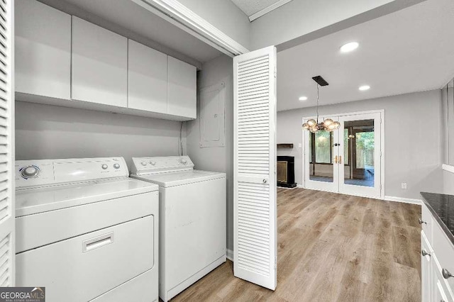 washroom featuring cabinet space, washer and dryer, light wood-style flooring, recessed lighting, and baseboards