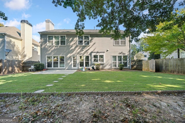back of property with a patio