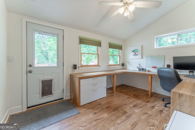office area featuring light wood-style flooring, a ceiling fan, and vaulted ceiling