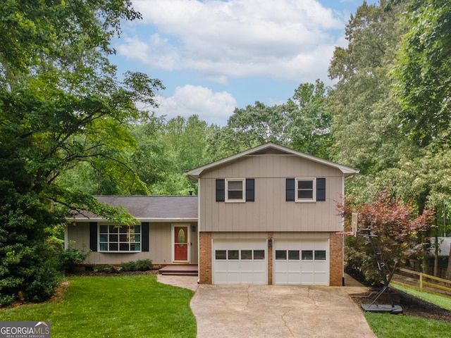 split level home with concrete driveway, an attached garage, and brick siding