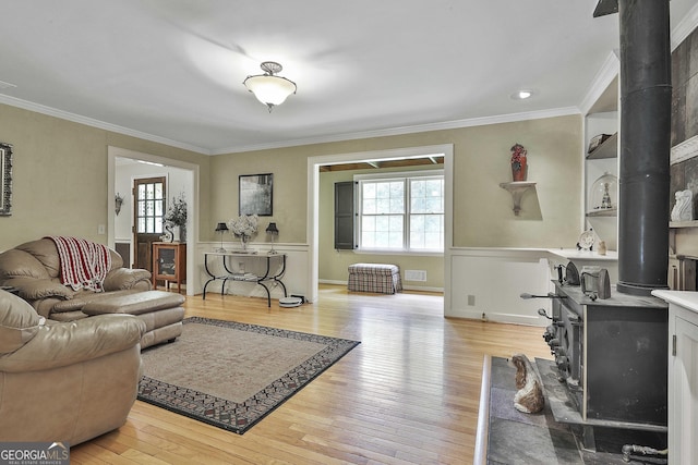 159 May Ln, Zebulon, GA 30295 - living area with ornamental molding, light wood finished floors, a wealth of natural light, and a wood stove