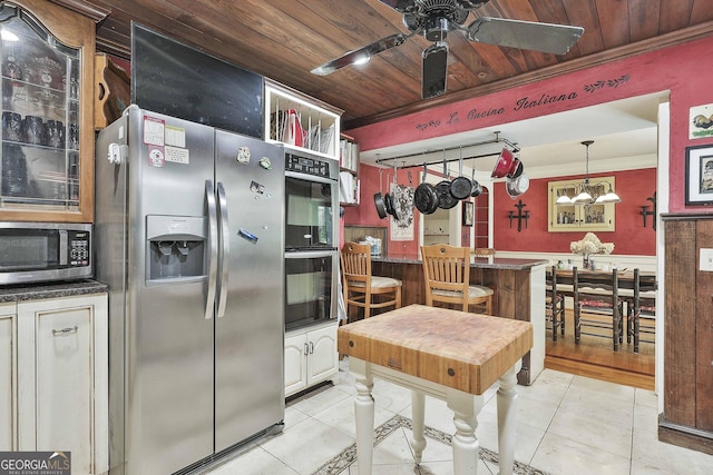 159 May Ln, Zebulon, GA 30295 - kitchen featuring wood ceiling, appliances with stainless steel finishes, ceiling fan with notable chandelier, ornamental molding, and light tile patterned flooring