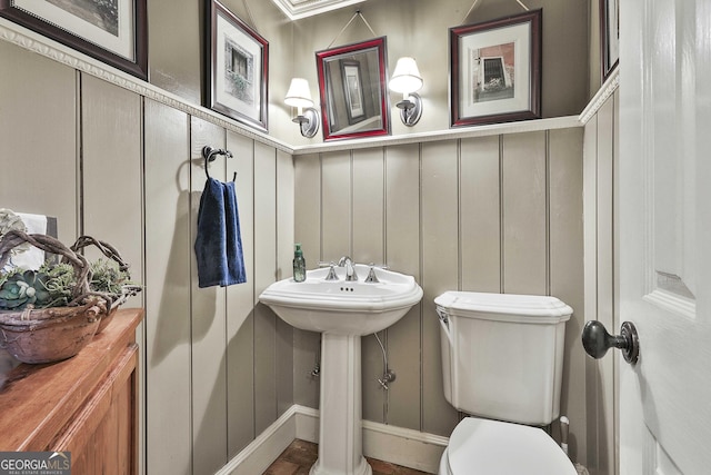 159 May Ln, Zebulon, GA 30295 - bathroom with a sink, wainscoting, a decorative wall, and toilet