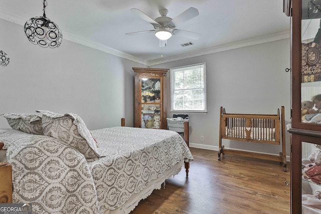 159 May Ln, Zebulon, GA 30295 - bedroom with visible vents, crown molding, wood finished floors, baseboards, and a ceiling fan