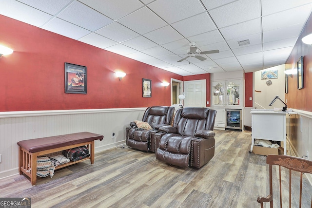 159 May Ln, Zebulon, GA 30295 - home theater room featuring a ceiling fan, visible vents, wood finished floors, beverage cooler, and a drop ceiling