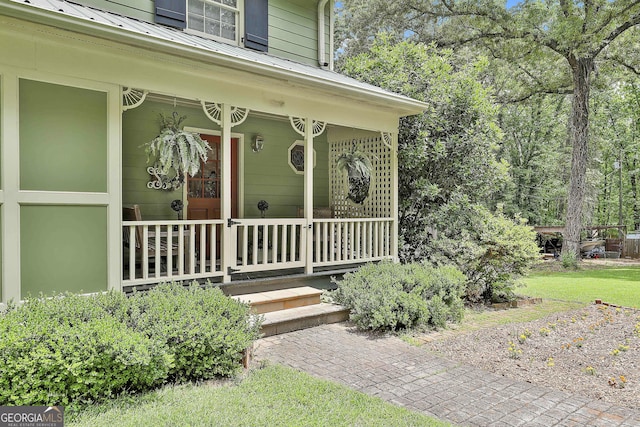 159 May Ln, Zebulon, GA 30295 - doorway to property featuring covered porch and metal roof