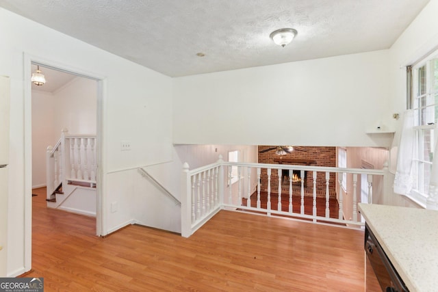 3240 Corktree Trl, Stonecrest, GA 30038 - staircase with a textured ceiling and wood finished floors