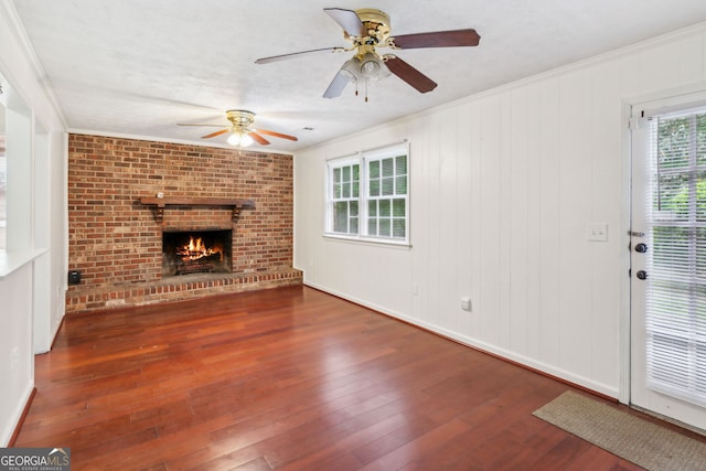 3240 Corktree Trl, Stonecrest, GA 30038 - unfurnished living room featuring a ceiling fan, ornamental molding, a fireplace, and hardwood / wood-style flooring