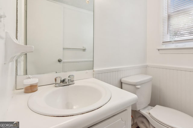 3240 Corktree Trl, Stonecrest, GA 30038 - bathroom featuring a wainscoted wall, vanity, and toilet