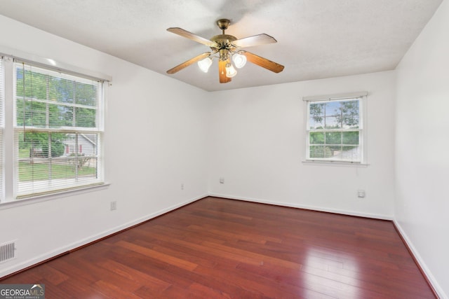 3240 Corktree Trl, Stonecrest, GA 30038 - unfurnished room featuring a ceiling fan, plenty of natural light, and wood finished floors