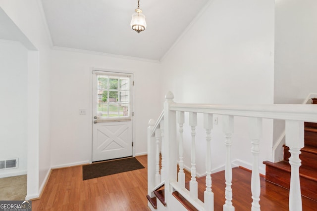 3240 Corktree Trl, Stonecrest, GA 30038 - entryway featuring ornamental molding, lofted ceiling, wood finished floors, and visible vents