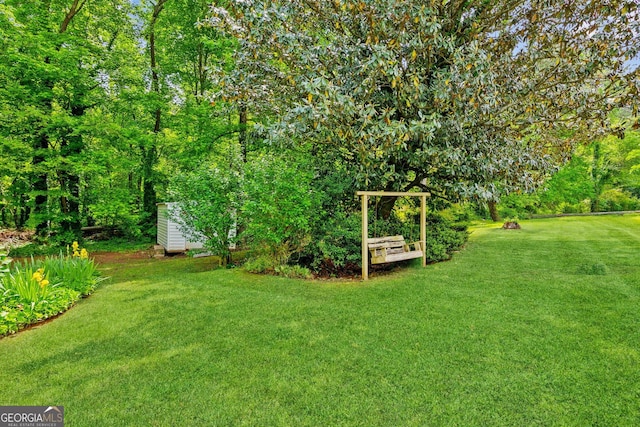 3240 Corktree Trl, Stonecrest, GA 30038 - view of yard with an outdoor structure and a shed