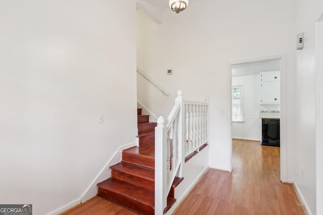 3240 Corktree Trl, Stonecrest, GA 30038 - stairway with baseboards and wood finished floors