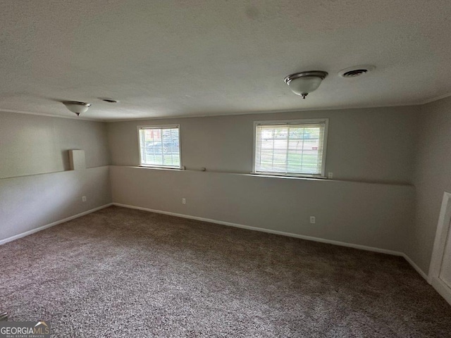 2036 Countydown Ln, Stone Mountain, GA 30088 - carpeted spare room featuring a textured ceiling and baseboards
