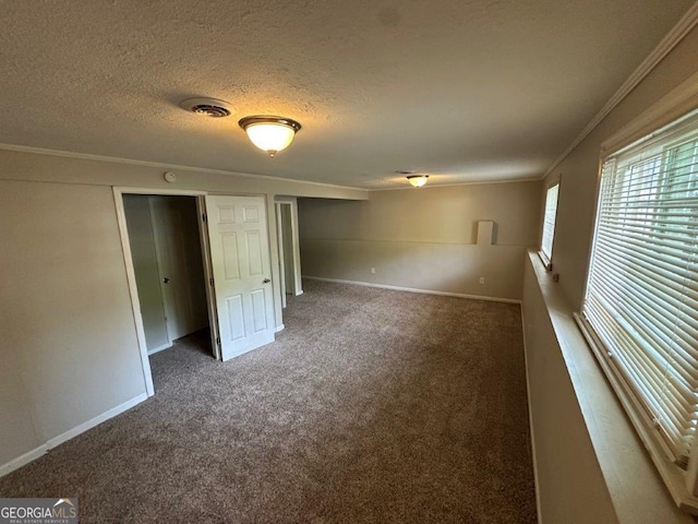 2036 Countydown Ln, Stone Mountain, GA 30088 - spare room featuring carpet floors, ornamental molding, baseboards, and a textured ceiling