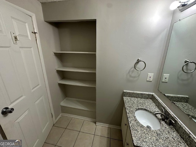 2036 Countydown Ln, Stone Mountain, GA 30088 - bathroom with tile patterned floors, vanity, and baseboards