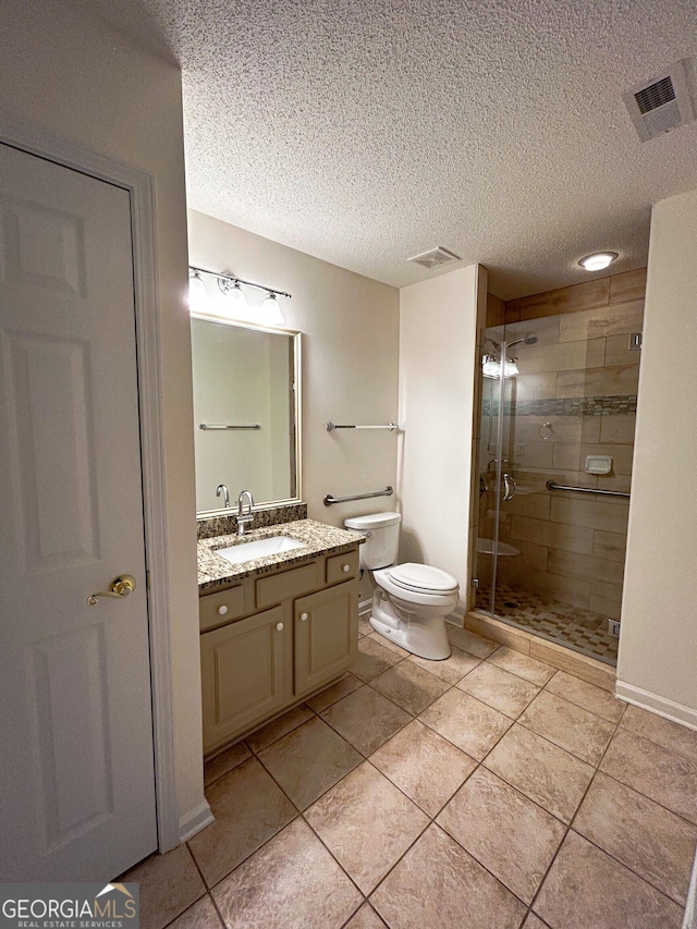 3077 Oakside Cir, Milton, GA 30004 - bathroom with a stall shower, vanity, tile patterned flooring, and a textured ceiling
