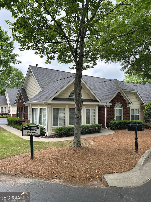 3077 Oakside Cir, Milton, GA 30004 - view of front of house with brick siding and roof with shingles