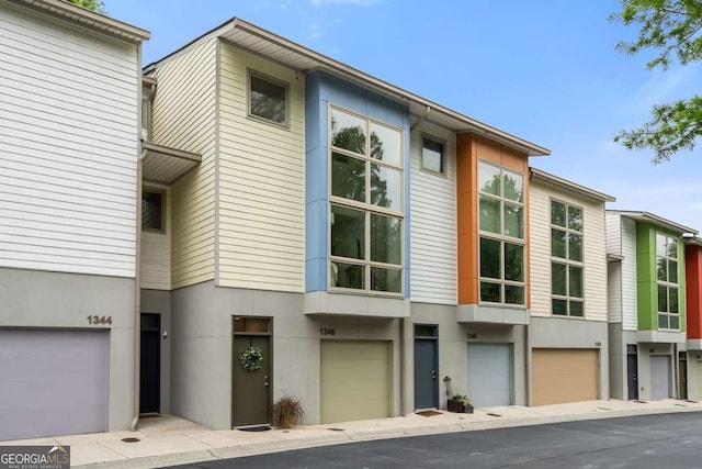 1346 Peter Haughton Way NW, Atlanta, GA 30318 - view of building exterior with a garage
