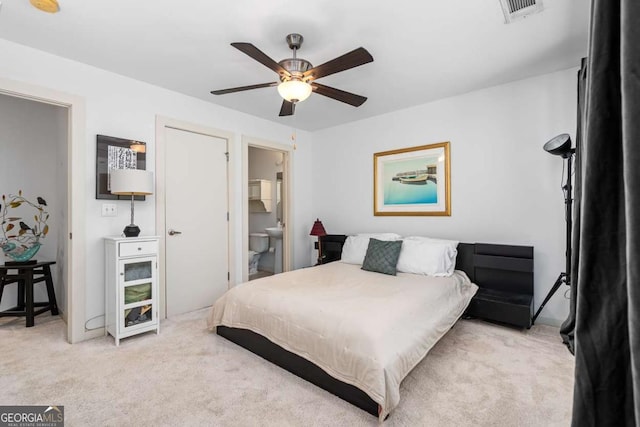 1346 Peter Haughton Way NW, Atlanta, GA 30318 - carpeted bedroom featuring ensuite bath and a ceiling fan