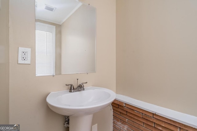 1774 Campbellton Rd, Atlanta, GA 30311 - bathroom with ornamental molding and a sink