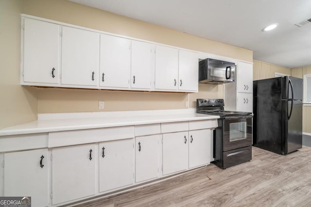1774 Campbellton Rd, Atlanta, GA 30311 - kitchen featuring black appliances, light wood-type flooring, light countertops, white cabinetry, and recessed lighting