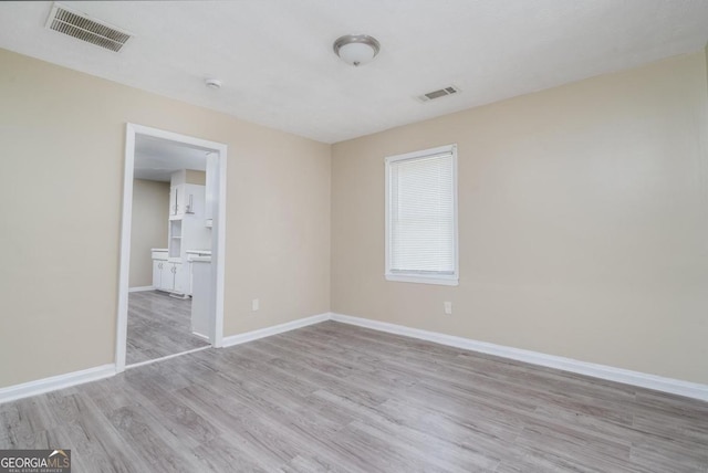1774 Campbellton Rd, Atlanta, GA 30311 - bathroom featuring crown molding, visible vents, and a sink