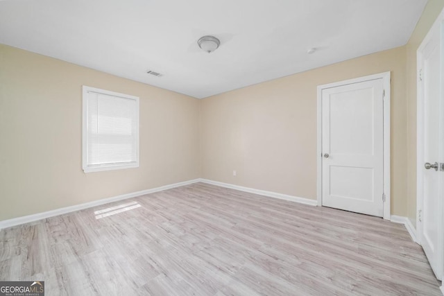 1774 Campbellton Rd, Atlanta, GA 30311 - unfurnished bedroom with light wood-style flooring and ensuite bathroom