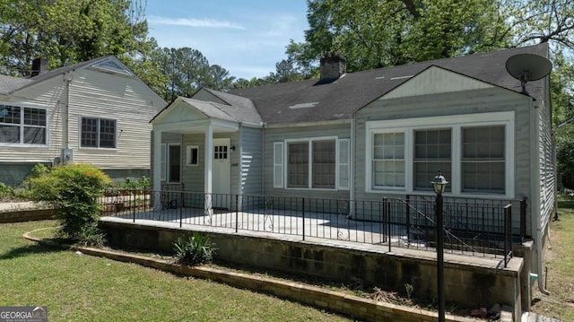 1774 Campbellton Rd, Atlanta, GA 30311 - back of house with a lawn and a chimney