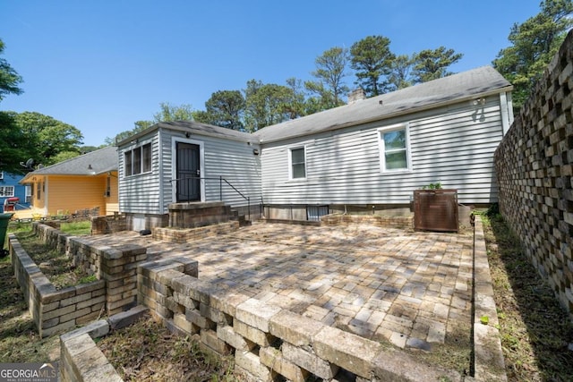 1774 Campbellton Rd, Atlanta, GA 30311 - back of property with a patio, central AC, and a chimney