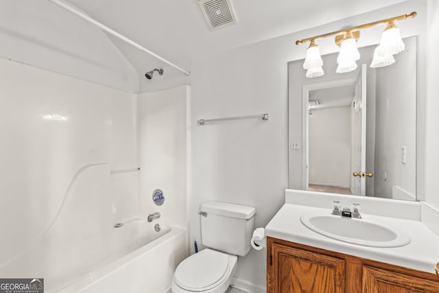bathroom featuring visible vents, vanity, lofted ceiling, toilet, and shower / washtub combination