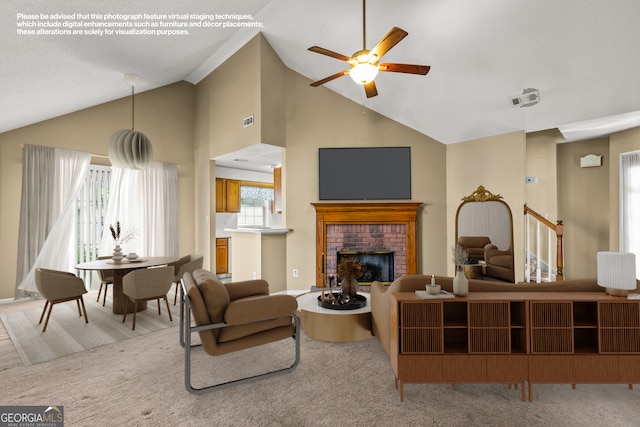 living area with a ceiling fan, high vaulted ceiling, light carpet, and a fireplace