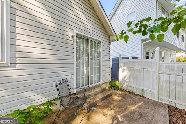 view of patio with fence and entry steps