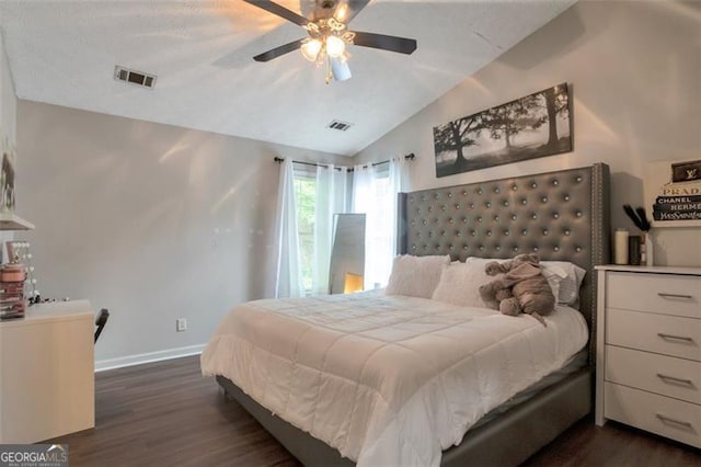 3130 Jorden Crest Ct, Lawrenceville, GA 30044 - bedroom with baseboards, visible vents, vaulted ceiling, and dark wood-type flooring