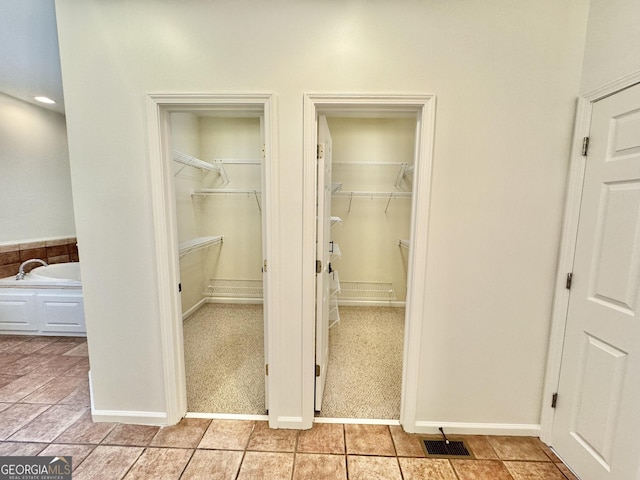 closet featuring a sink and visible vents