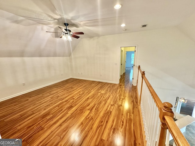 interior space featuring visible vents, wood finished floors, recessed lighting, a ceiling fan, and vaulted ceiling