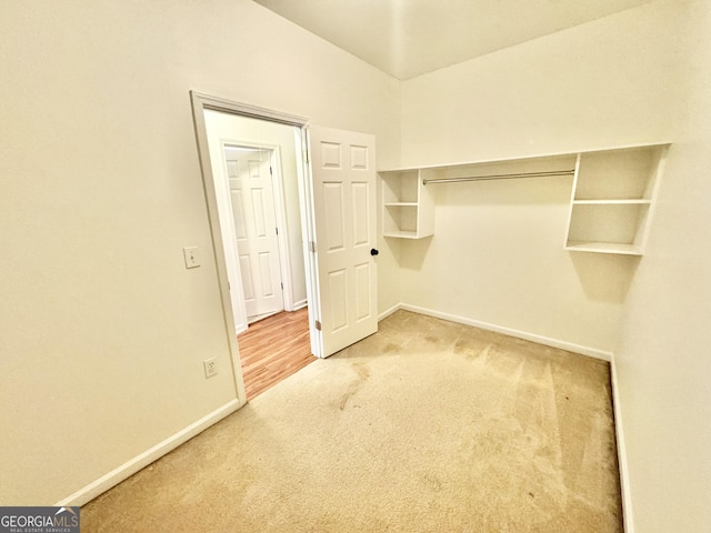 walk in closet featuring carpet