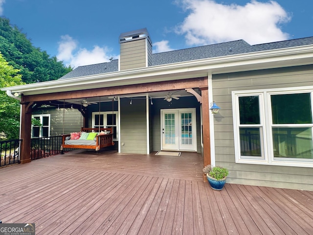 wooden deck featuring french doors and ceiling fan