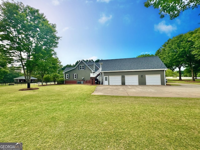 view of front of property featuring a garage and a front yard