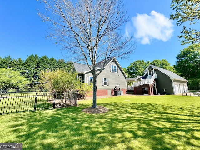 view of yard featuring central air condition unit and fence