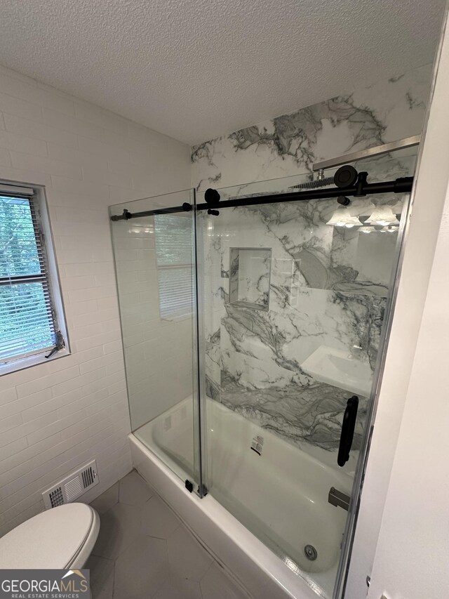 room details featuring a marble finish shower