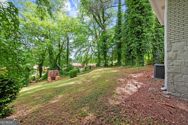 view of yard with central AC unit