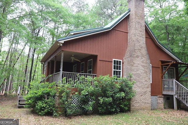view of property exterior featuring ceiling fan and a chimney