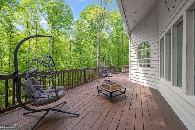 wooden deck with a fire pit